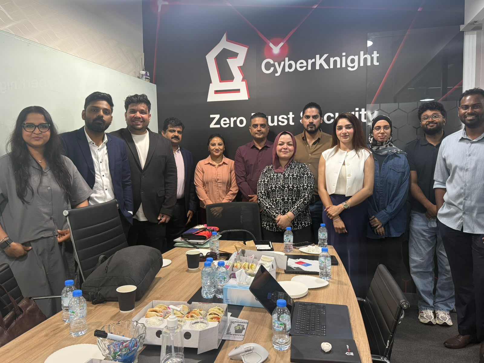 CyberKnight team gathered at the Zero Trust Security office wall
